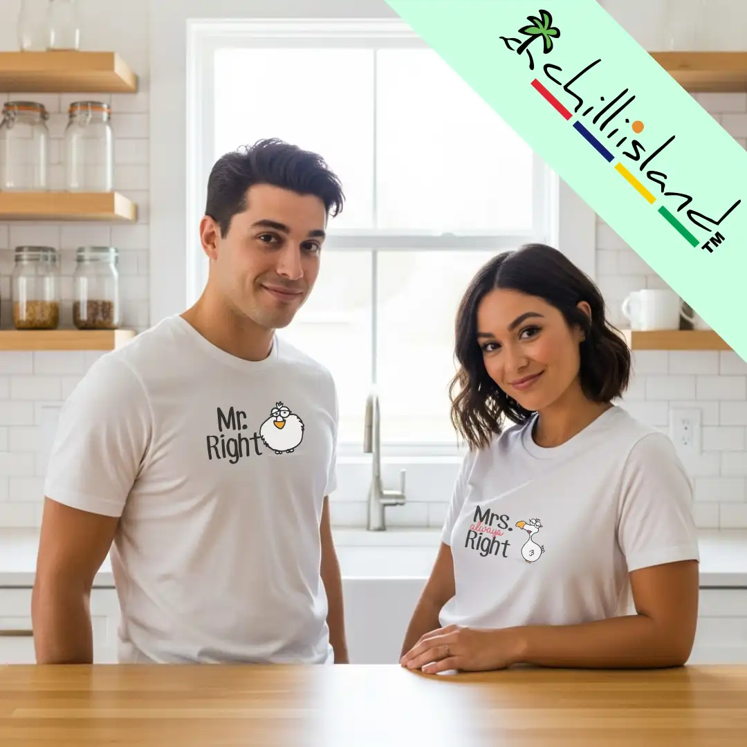 A smiling couple in a bright kitchen wearing matching white Chilliisland T-shirts. His shirt reads "Mr. Right," hers "Mrs. Always Right." Cheerful and playful vibe.